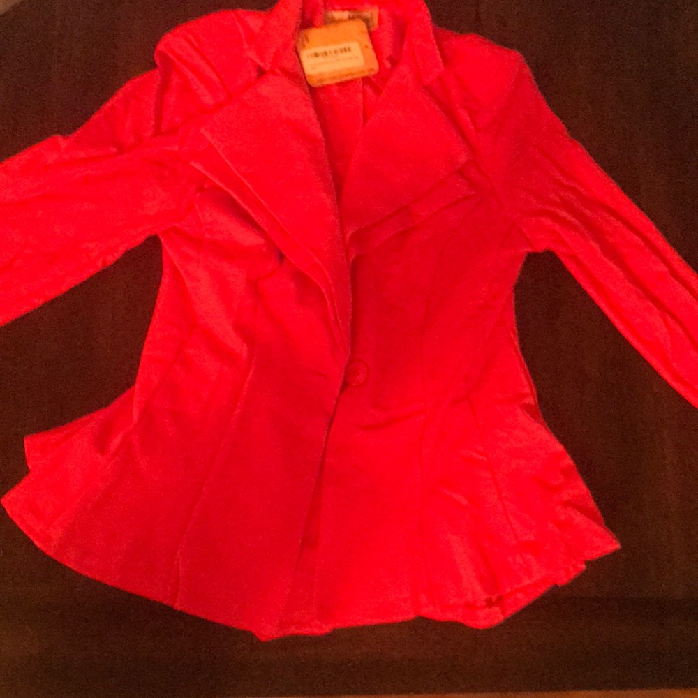 Brand New! Large, Coral blazer with a-frame cut. Cute longer cut in the back.